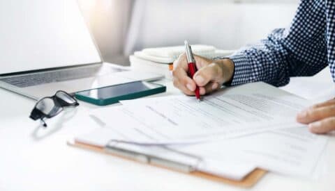 Consultant reviewing tax incentive paperwork