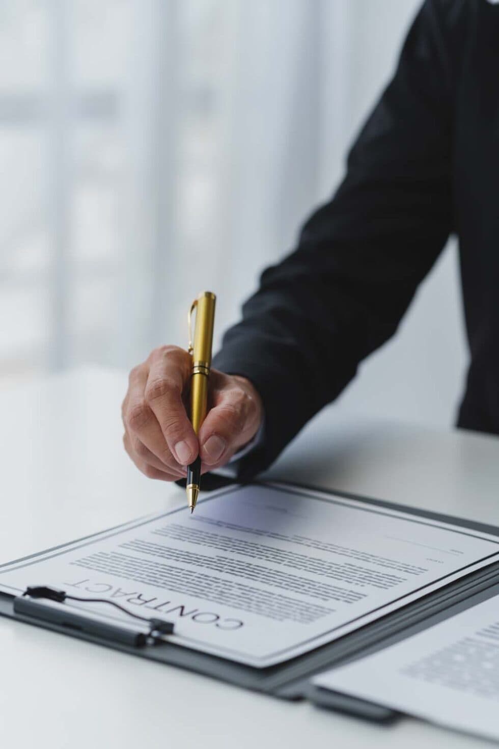 Professional signing a real estate contract